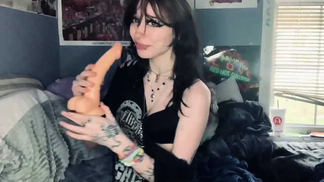 delicious busty woman masturbating and sucking a dildo