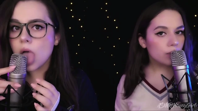 two girlfriends lick ears one is shy the other likes it.