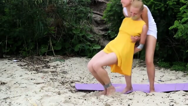 Girl Tied And Gagged In Trashbags On The Beach