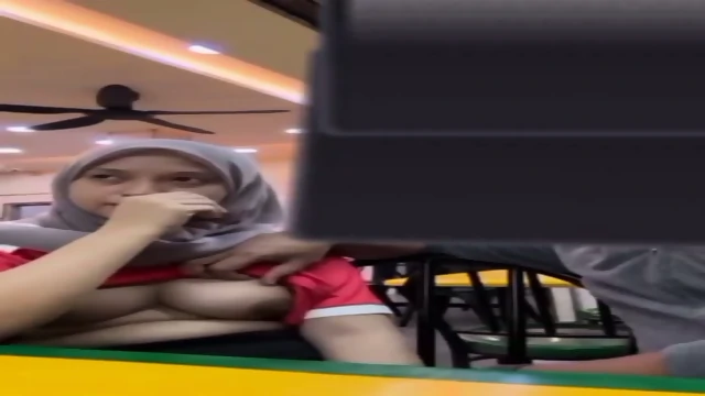 Hijabi girl boobs pressing by bf in restaurant