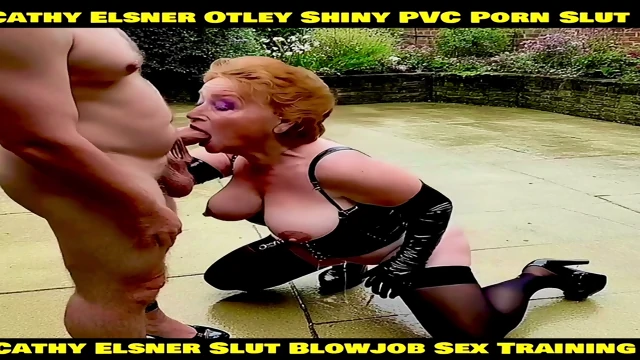 Cathy Shiny PVC Otley Pornstar Slut Granny Outdoors in Public Car Park Sucking off a Big Fat Thick Cock Naughty Cathy Yorkshire Cock Sucking Slut in Amateur Blowjob Porn Film Clothed in Shiny PVC Suspender Belt Black Stockings and Shiny High Heels