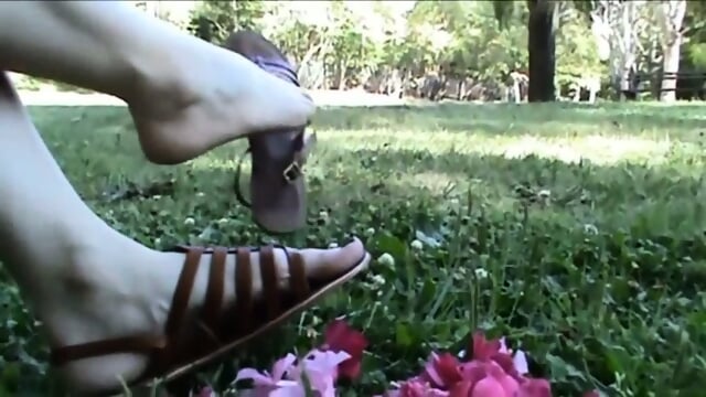 Christine Rubs Pink Petals With Her Sandals