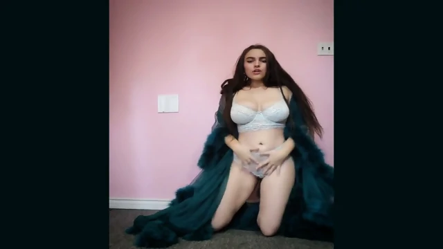 Busty Brunette's Sensual Striptease in BDSM-themed Lingerie