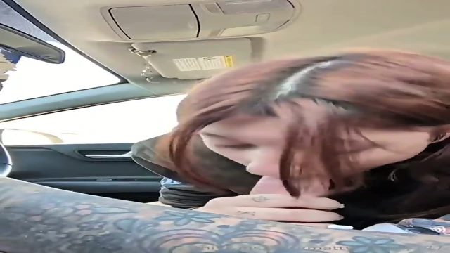 Brunette college girl giving handjob while he’s driving