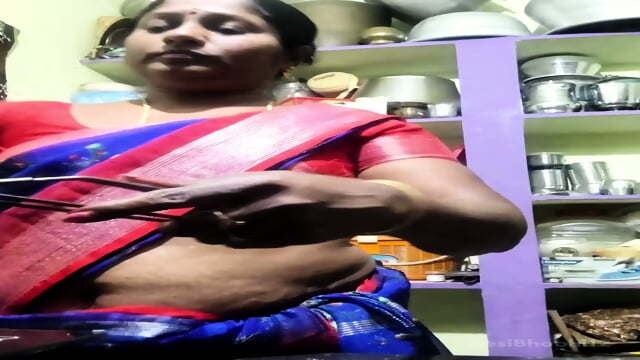 She goes while cooking in kitchen