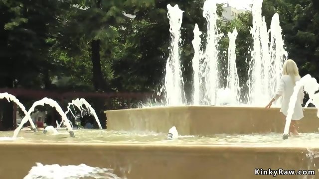 Blonde made to bath in public fountain
