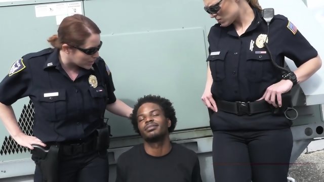 Redhead cop sucks a big black cock in front of her horny partner that is waiting to fuck it hard.