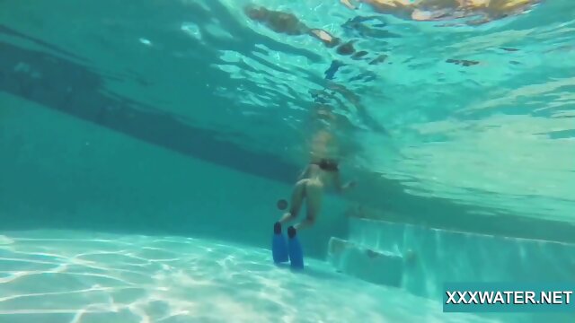 Hot brunette slut Candy swims underwater