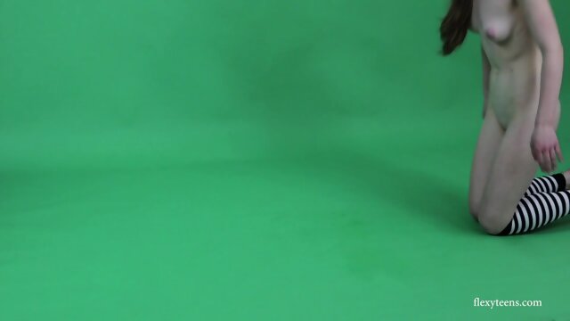 Young brunette gymnast Anna Mostik spreading legs