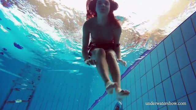 Cute hairy pussy teenie Nina in the swimming pool