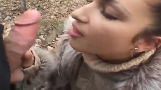 Girl in fur coat give blowjob in forest