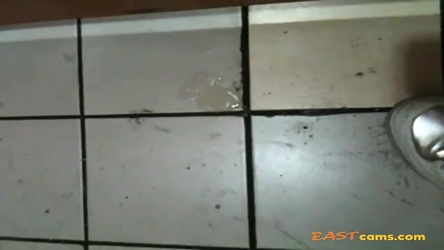 Korean girl sucks cock in a bathroom gloryhole and gets cum