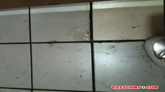 Korean girl sucks cock in a bathroom gloryhole and gets cum