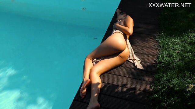Eyla Moore, a famous model, glides elegantly through the water