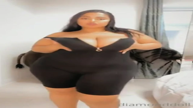 Thick D 67 in a black dress